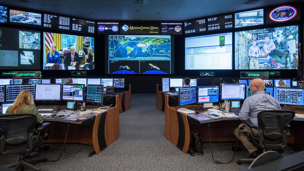 jsc2017e049156 (April 24, 2017) --- Flight Director Brian Smith, Capcom Astronaut Jessica Meir along with Astronaut Jeff Williams monitor activities in Mission Control as President Donald Trump, First Daughter Ivanka Trump and NASA astronaut Kate Rubins make a special Earth-to-space call from the Oval Office to personally congratulate NASA astronaut Peggy Whitson for her record-breaking stay aboard the International Space Station. (Photo Credit: NASA/Robert Markowitz)