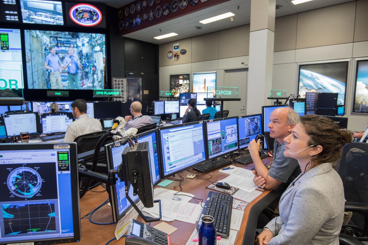jsc2017e049162 (April 24, 2017) --- Flight Director Brian Smith, Capcom Astronaut Jessica Meir along with Astronaut Jeff Williams monitor activities in Mission Control as President Donald Trump, First Daughter Ivanka Trump and NASA astronaut Kate Rubins make a special Earth-to-space call from the Oval Office to personally congratulate NASA astronaut Peggy Whitson for her record-breaking stay aboard the International Space Station. (Photo Credit: NASA/Robert Markowitz)
