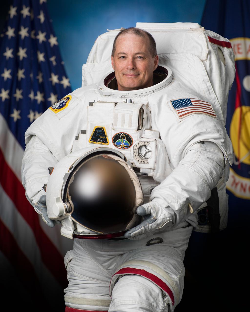 jsc2017e063393 (May 24, 2017) --- Official portrait of NASA astronaut and Expedition 54-55 Flight Engineer Scott Tingle in an Extravehicular Mobility Unit.