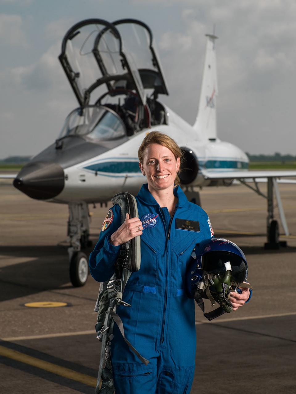 jsc2017e067120 (June 6, 2017) --- NASA portrait of 2017 Astronaut Candidate Loral O'Hara in front of a T-38 trainer aircraft at Ellington Field near NASA’s Johnson Space Center in Houston, Texas.