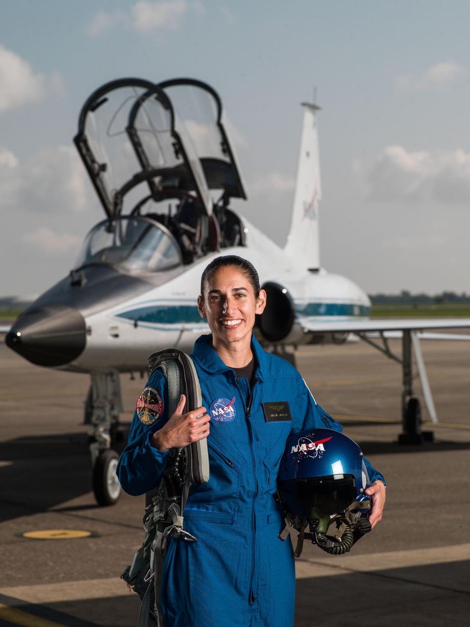 jsc2017e067122 (June 6, 2017) --- NASA portrait of 2017 Astronaut Candidate Jasmin Moghbeli in front of a T-38 trainer aircraft at Ellington Field near NASA’s Johnson Space Center in Houston, Texas.