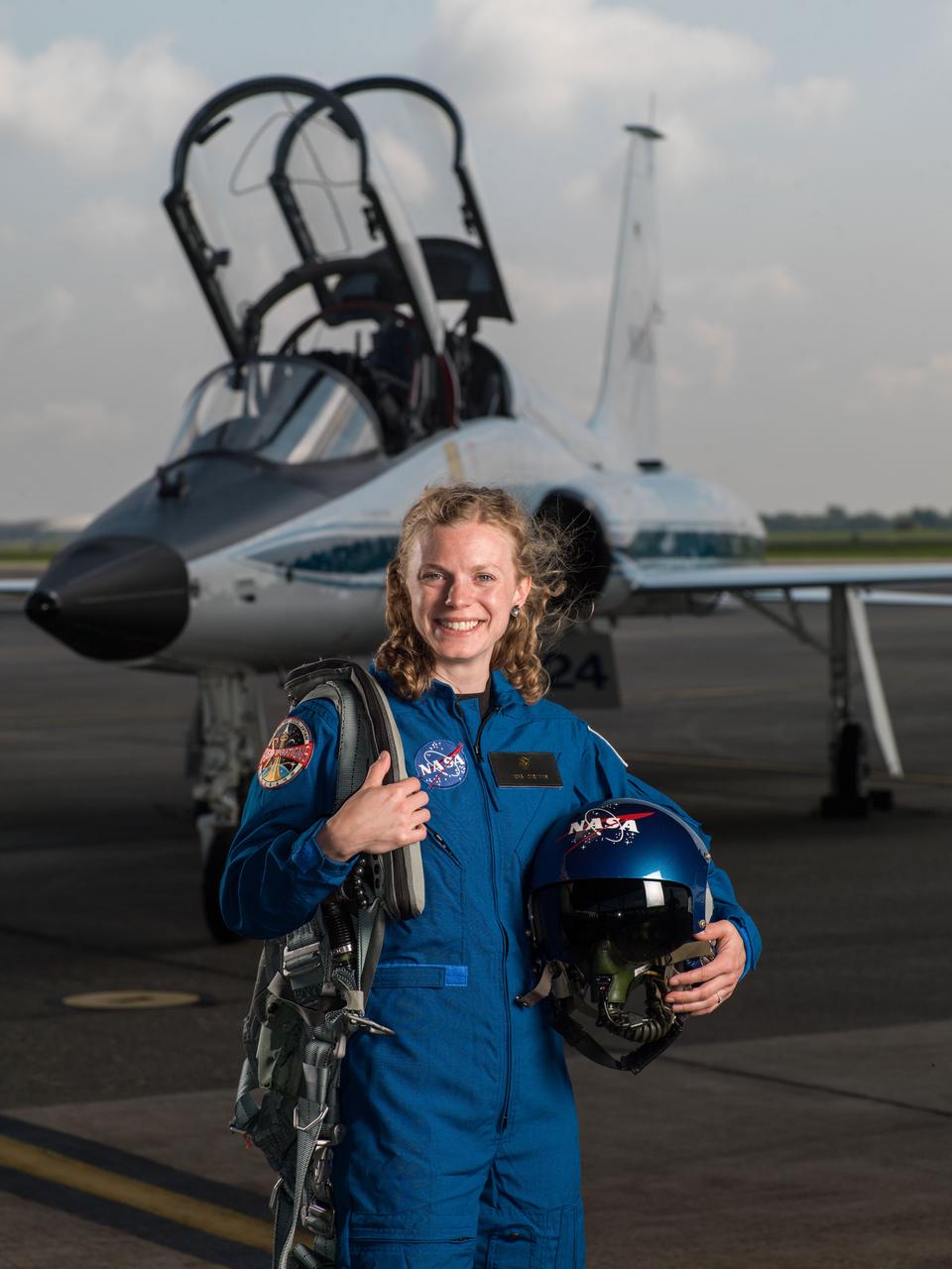 jsc2017e067124 (June 6, 2017) --- NASA portrait of 2017 Astronaut Candidate Zena Cardman in front of a T-38 trainer aircraft at Ellington Field near NASA’s Johnson Space Center in Houston, Texas.