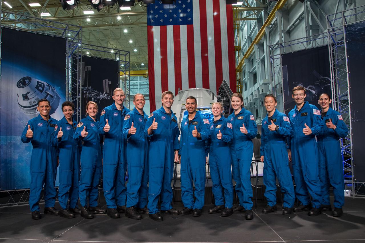 jsc2017e067188 (June 7, 2018) --- NASA introduced 12 new astronaut candidates, (from left) Francisco Rubio, Jessica Watkins, Loral O’Hara, Warren Hoburg, Robert Hines, Mathew Dominick, Raja Chari, Zena Cardman, Kayla Barron, Jonathan Kim, Robb Kulin and Jasmin Moghbeli, at NASA’s Johnson Space Center in Houston, Texas. After completing two years of training, the new astronaut candidates could be assigned to missions performing research on the International Space Station, launching from American soil on spacecraft built by commercial companies, and launching on deep space missions on NASA’s new Orion spacecraft and Space Launch System rocket. Photo Credit: (NASA/Robert Markowitz)