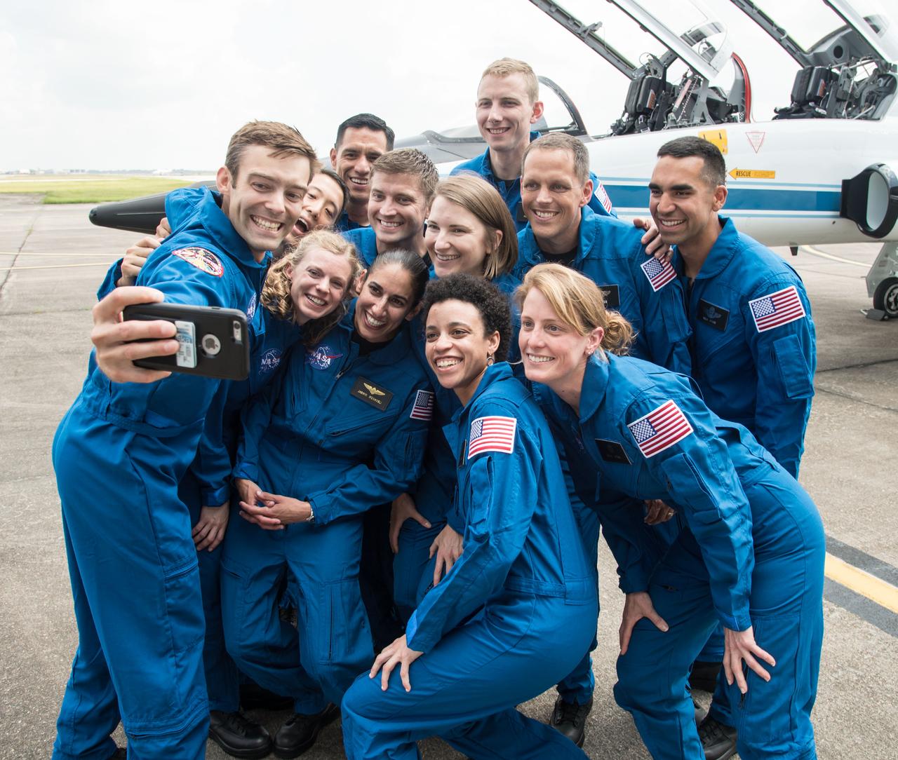 jsc2017e067273 (June 6, 2017) --- NASA’s 2017 Astronaut Candidate Class stopped for a group photo while getting fitted for flight suits at Ellington Airport near NASA’s Johnson Space Center in Houston, Texas.