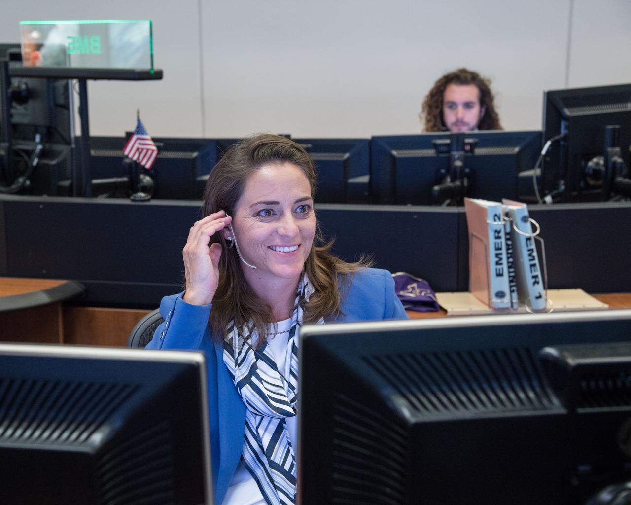 jsc2018e088236 (July 3, 2017) --- Portrait of NASA astronaut Nicole Mann seated at the CAPCOM console in Houston's Mission Control Center during the release of the SpaceX Dragon cargo vehicle from the International Space Station.