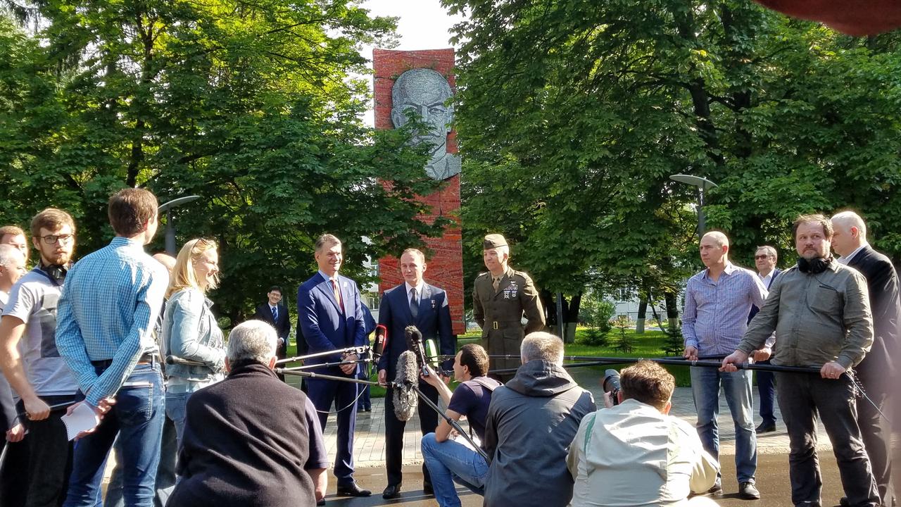jsc2017e095967 (July 16, 2017) --- With a tree-shrouded statue of Vladimir Lenin serving as a backdrop at the Gagarin Cosmonaut Training Center in Star City, Russia, Expedition 52-53 crewmember Sergey Ryazanskiy of the Russian Federal Space Agency (Roscosmos, center) answers a reporter’s question July 16 as his crewmates, Paolo Nespoli of the European Space Agency (left) and Randy Bresnik of NASA (right) look on. The trio flew to the Baikonur Cosmodrome in Kazakhstan for final pre-launch training for their launch July 28 on the Soyuz MS-05 spacecraft and a five-month mission on the International Space Station. Credit: NASA/Beth Weissinger