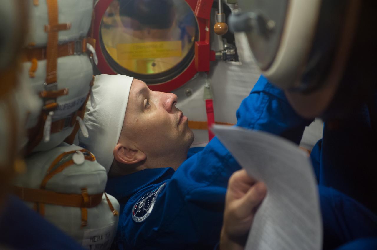 jsc2017e096665 (July 17, 2017) --- In the Integration Facility at the Baikonur Cosmodrome in Kazakhstan, Expedition 52-53 crewmember Randy Bresnik of NASA is seen inside his Soyuz MS-05 spacecraft July 17 during a fit dress rehearsal. Bresnik, Sergey Ryazanskiy of the Russian Federal Space Agency (Roscosmos) and Paolo Nespoli of the European Space Agency will launch July 28 on the Soyuz MS-05 spacecraft for a five-month mission on the International Space Station. Credit: Andrey Shelepin/Gagarin Cosmonaut Training Center