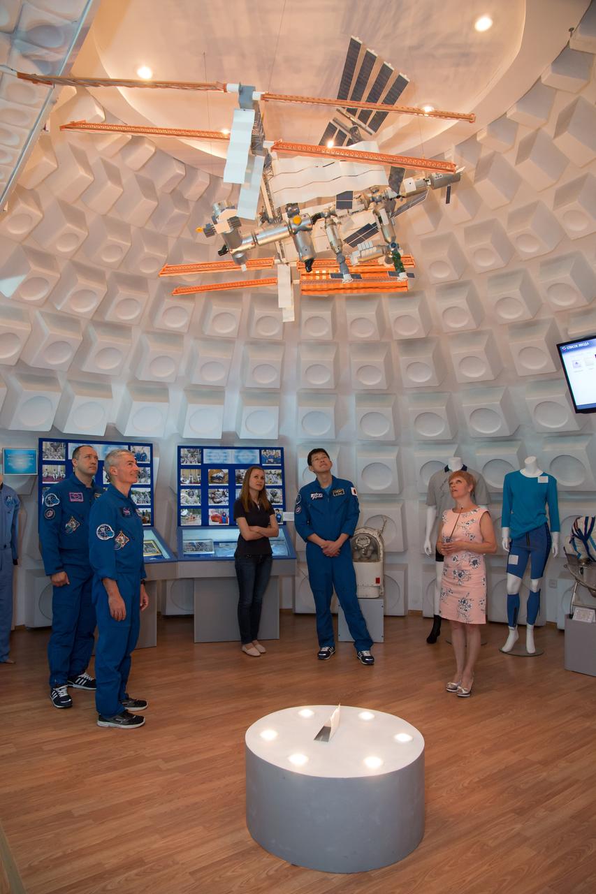 jsc2017e100904 (July 18, 2017) --- Expedition 52-53 backup crewmembers Alexander Misurkin of the Russian Federal Space Agency (Roscosmos, left), Mark Vande Hei of NASA (second from left) and Norishige Kanai of the Japan Aerospace Exploration Agency (JAXA, second from right) receive a briefing on some of the artifacts in the space museum in the town of Baikonur, Kazakhstan July 18. The three are serving as backups to Sergey Ryazanskiy of Roscosmos, Randy Bresnik of NASA and Paolo Nespoli of the European Space Agency, who will launch July 28 on the Soyuz MS-05 spacecraft from the Baikonur Cosmodrome for a five-month mission on the International Space Station. Credit: NASA/Victor Zelentsov