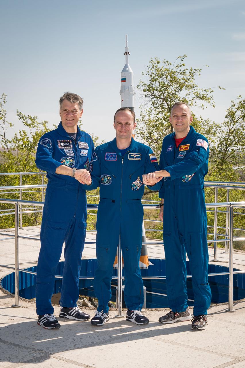 jsc2017e101937 (July 22, 2017) --- At the Cosmonaut Hotel crew quarters in Baikonur, Kazakhstan, Expedition 52-53 Flight Engineers Paolo Nespoli of the European Space Agency (left), Sergey Ryazanskiy of the Russian Federal Space Agency (Roscosmos, center) and Randy Bresnik of NASA (right) pose for pictures July 22 in the midst of pre-launch training. The trio will launch July 28 on the Soyuz MS-05 spacecraft from the Baikonur Cosmodrome for a five-month mission on the International Space Station. Credit: NASA/Victor Zelentsov