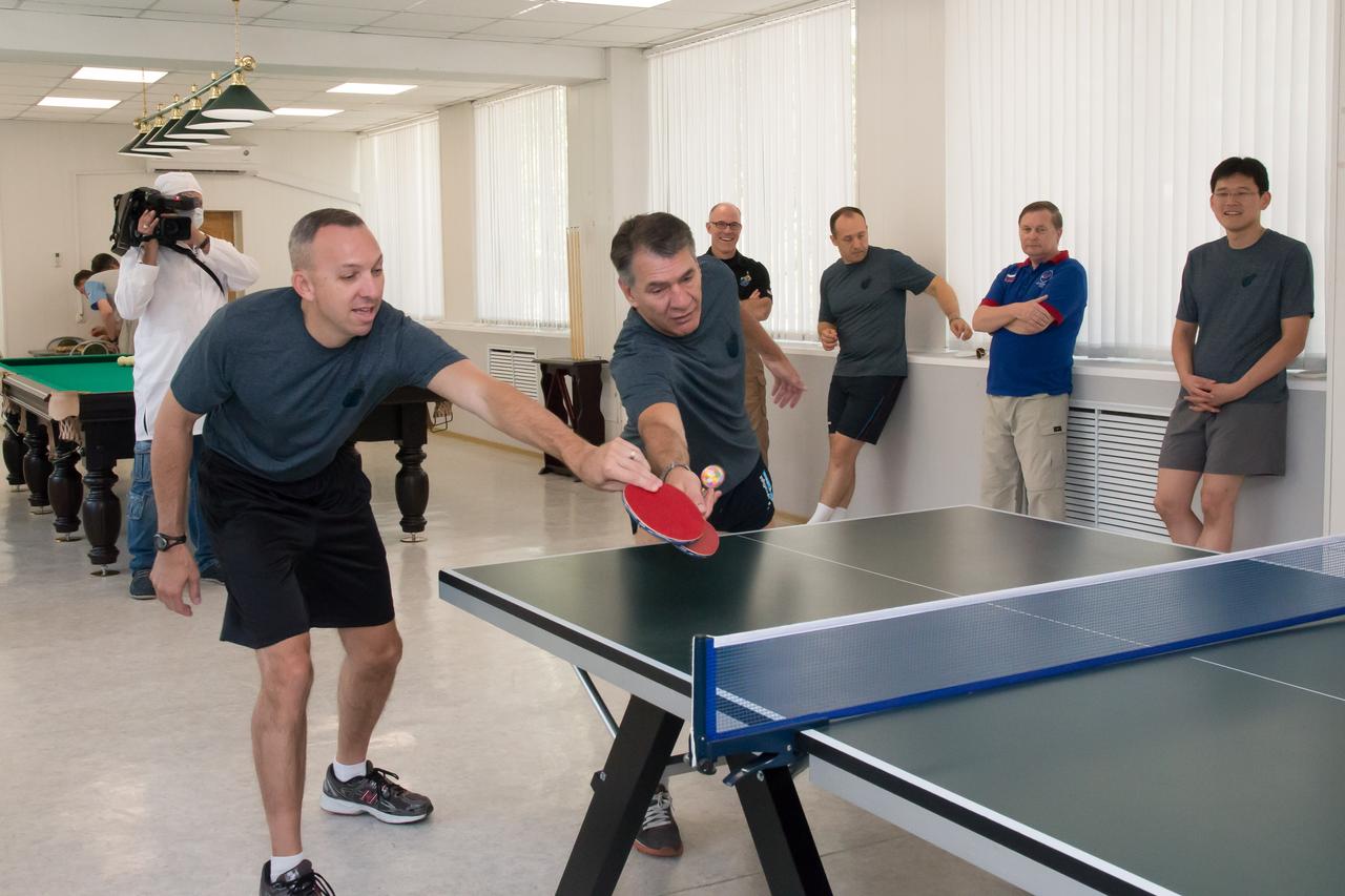 jsc2017e101943 (July 22, 2017) --- At the Cosmonaut Hotel crew quarters in Baikonur, Kazakhstan, Expedition 52-53 crewmembers Randy Bresnik of NASA (left) and Paolo Nespoli of the European Space Agency (right) try their hand at a game of ping-pong July 22 as part of their media day activities. Bresnik, Nespoli and Sergey Ryazanskiy of the Russian Federal Space Agency (Roscosmos) will launch July 28 on the Soyuz MS-05 spacecraft from the Baikonur Cosmodrome for a five-month mission on the International Space Station. Credit: NASA/Victor Zelentsov