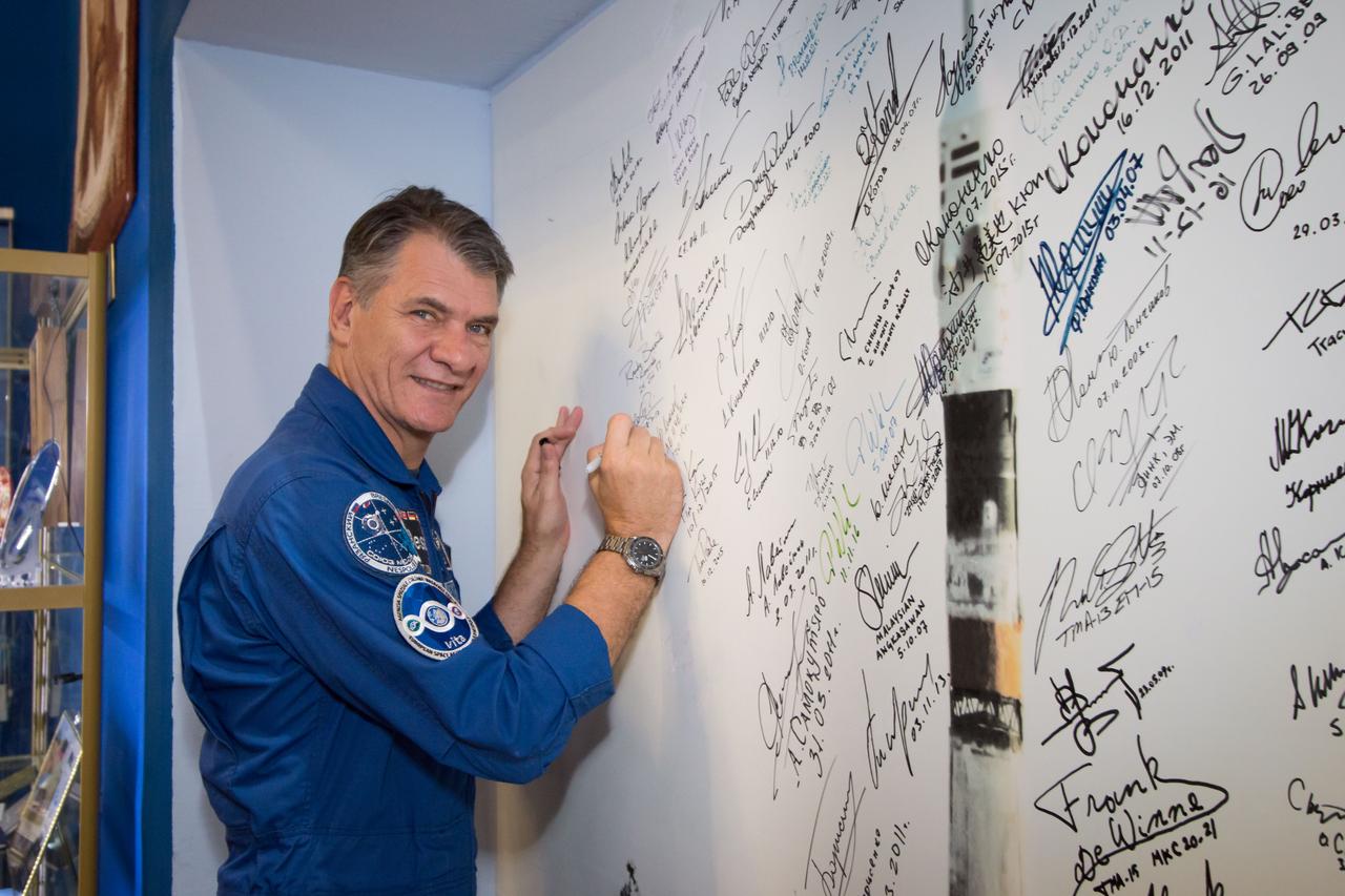 jsc2017e101947 (July 22, 2017) --- At the Baikonur Cosmodrome in Kazakhstan, Expedition 52-53 crewmember Paolo Nespoli of the European Space Agency signs a mural in the Korolev Museum July 24 as part of traditional pre-launch activities. Nespoli, Randy Bresnik of NASA and Sergey Ryazanskiy of the Russian Federal Space Agency (Roscosmos) will launch July 28 aboard the Soyuz MS-05 spacecraft for a five-month mission on the International Space Station. Credit: NASA/Victor Zelentsov