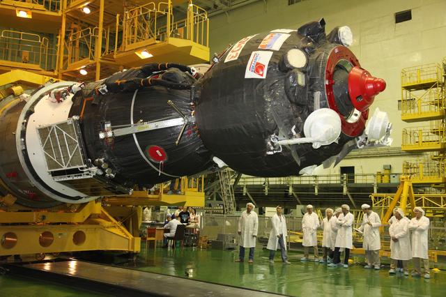 jsc2017e101956 (July 22, 2017) --- In the Integration Facility at the Baikonur Cosmodrome in Kazakhstan, the Soyuz MS-05 spacecraft is lowered to a horizontal position to be encapsulated in the upper stage of a Soyuz booster July 21 in preparation for its launch. Expedition 52-53 crewmembers Sergey Ryazanskiy of the Russian Federal Space Agency (Roscosmos), Randy Bresnik of NASA and Paolo Nespoli of the European Space Agency will launch July 28 on the Soyuz MS-05 for a five-month mission on the International Space Station. Credit: Roscosmos