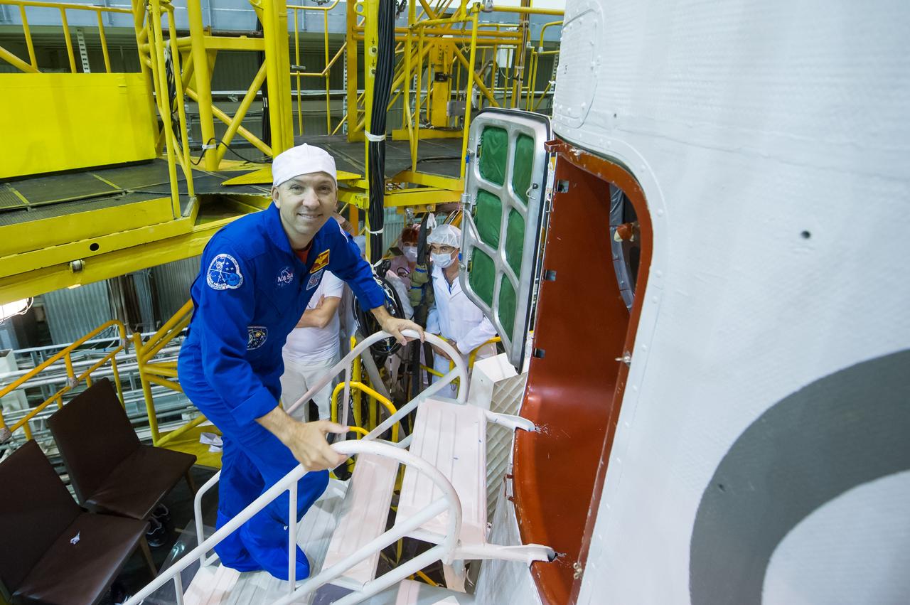 jsc2017e101960 (July 22, 2017) --- In the Integration Facility at the Baikonur Cosmodrome in Kazakhstan, Expedition 52-53 crewmember Randy Bresnik of NASA boards the Soyuz MS-05 spacecraft July 24 during the final fit check dress rehearsal. Bresnik, Paolo Nespoli of the European Space Agency and Sergey Ryazanskiy of the Russian Federal Space Agency (Roscosmos) will launch July 28 aboard the Soyuz MS-05 spacecraft for a five-month mission on the International Space Station. Credit: Andrey Shelepin/Gagarin Cosmonaut Training Center