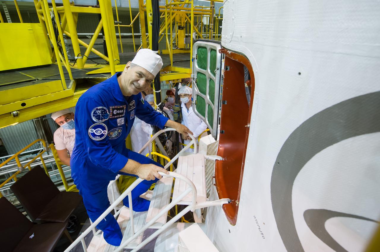 jsc2017e101961 (July 22, 2017) --- In the Integration Facility at the Baikonur Cosmodrome in Kazakhstan, Expedition 52-53 crewmember Paolo Nespoli of the European Space Agency boards the Soyuz MS-05 spacecraft July 24 during the final fit check dress rehearsal. Nespoli, Randy Bresnik of NASA and Sergey Ryazanskiy of the Russian Federal Space Agency (Roscosmos) will launch July 28 aboard the Soyuz MS-05 spacecraft for a five-month mission on the International Space Station. Credit: Andrey Shelepin/Gagarin Cosmonaut Training Center