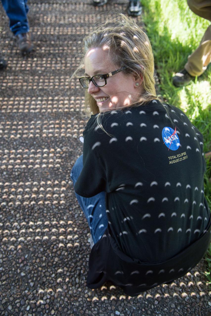 jsc2017e110791 (Aug. 21, 2017) --- Employees at NASA’s Johnson Space Center in Houston joined the rest of the country in experiencing the 2017 eclipse on Aug. 21, 2017. Many used protective eclipse glasses, and others made use of manufactured or pin-hole cameras of opportunity to view the eclipse. In Houston, the partial eclipse duration was 2 hours, 59 minutes, reaching its maximum level of 67 percent at 1:17 p.m. CDT. Some members of the team supporting the International Space Station in the Christopher C. Kraft Mission Control Center took advantage of a break in their duties to step outside the windowless building to witness what their colleagues in orbit also saw and documented with a variety of cameras.