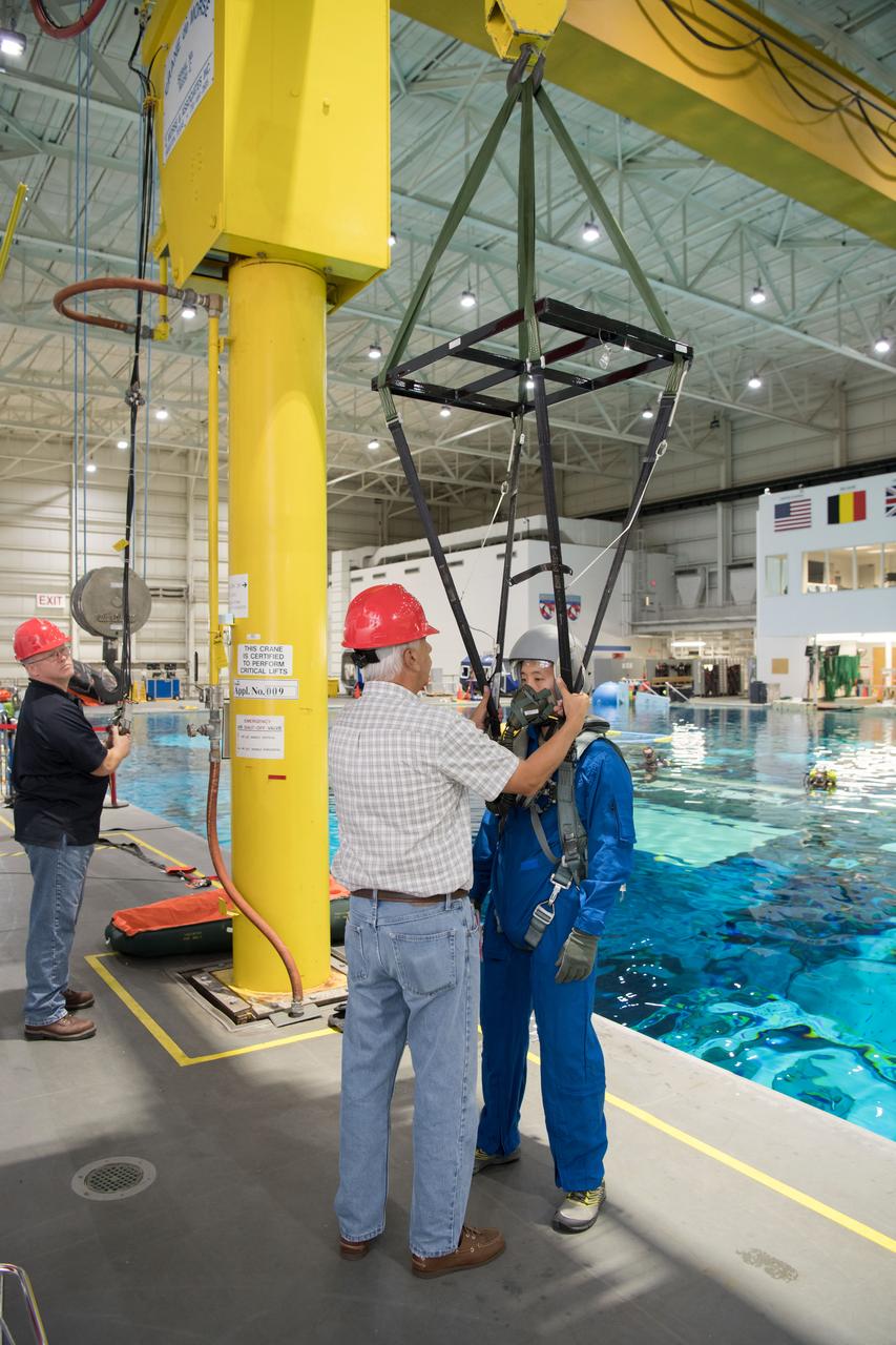 jsc2017e111703 (08-23-2017) --- During water survival training in 2017 at NASA Johnson Space Center’s Neutral Buoyancy Laboratory in Houston, NASA astronaut candidate Jonny Kim (right) is fitted for training gear by instructors. (NASA/David DeHoyos)