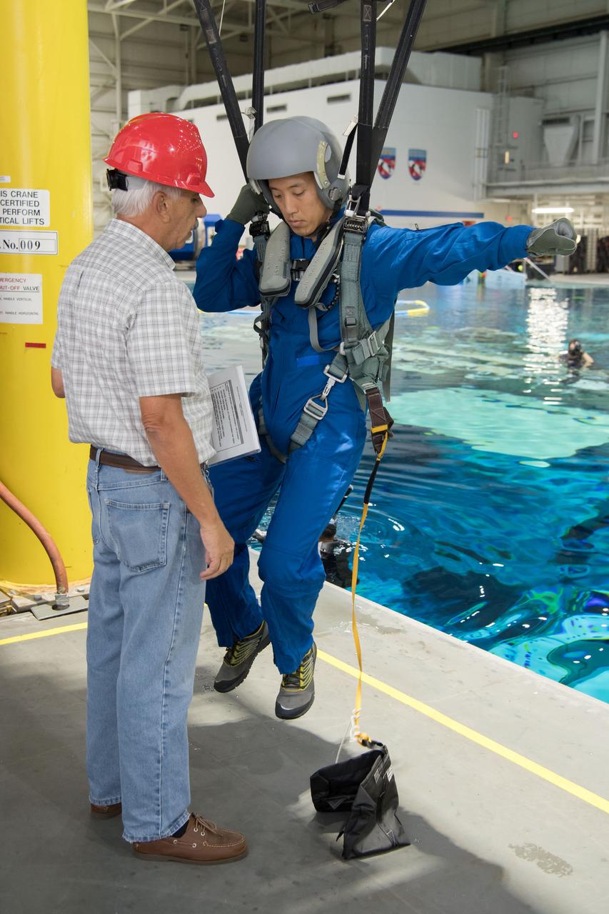 jsc2017e111705 (08-23-2017) --- During water survival training in 2017 at NASA Johnson Space Center’s Neutral Buoyancy Laboratory in Houston, Texas, NASA astronaut candidate Jonny Kim (right) works alongside instructors. Photo Credit: (NASA/David DeHoyos)