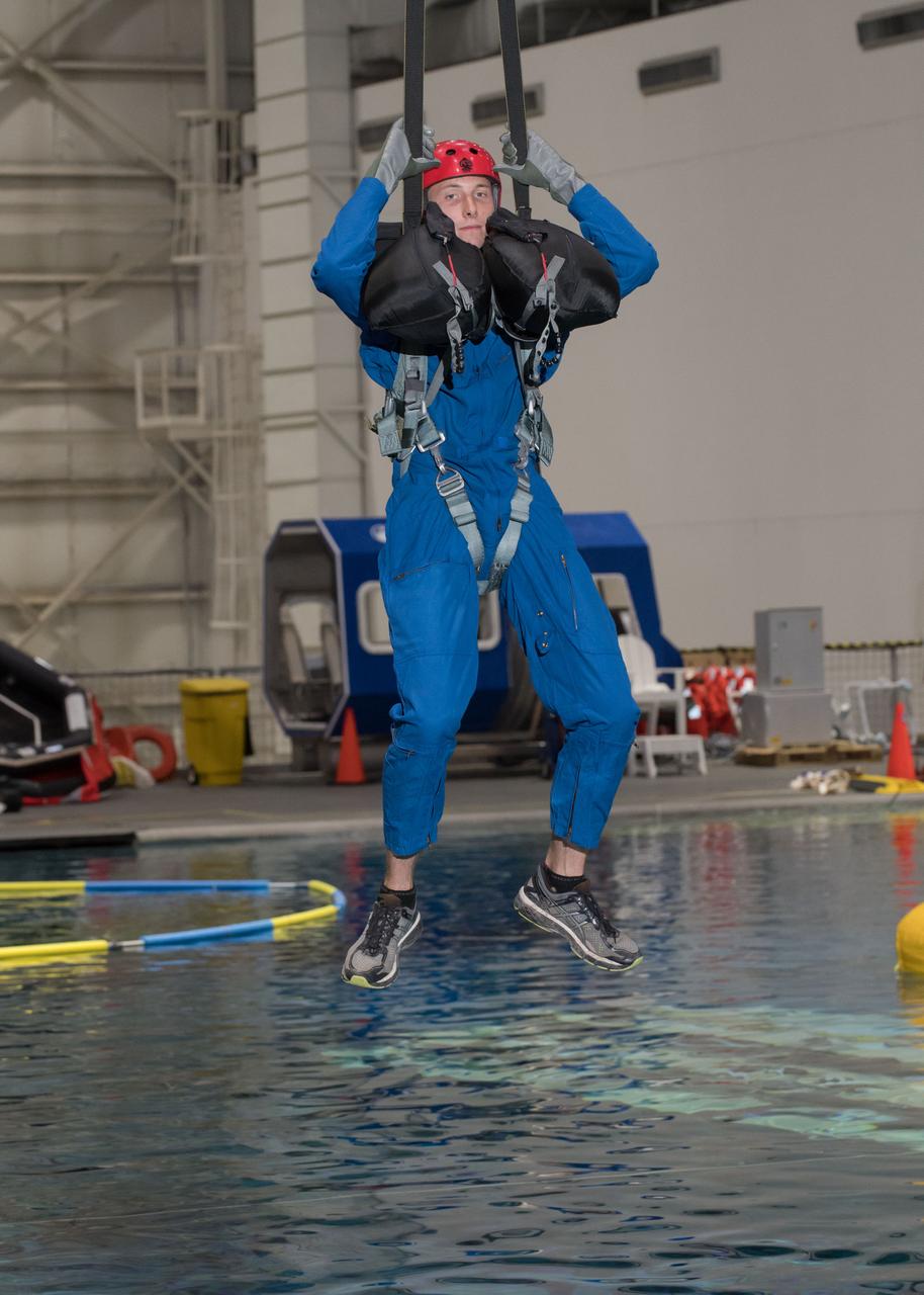 jsc2017e111736 (08-23-2017) ---2017 NASA astronaut candidate Warren Hoburg awaits next steps by instructors during water survival training at NASA Johnson Space Center’s Neutral Buoyancy Laboratory in Houston. Photo Credit: (NASA/David DeHoyos)
