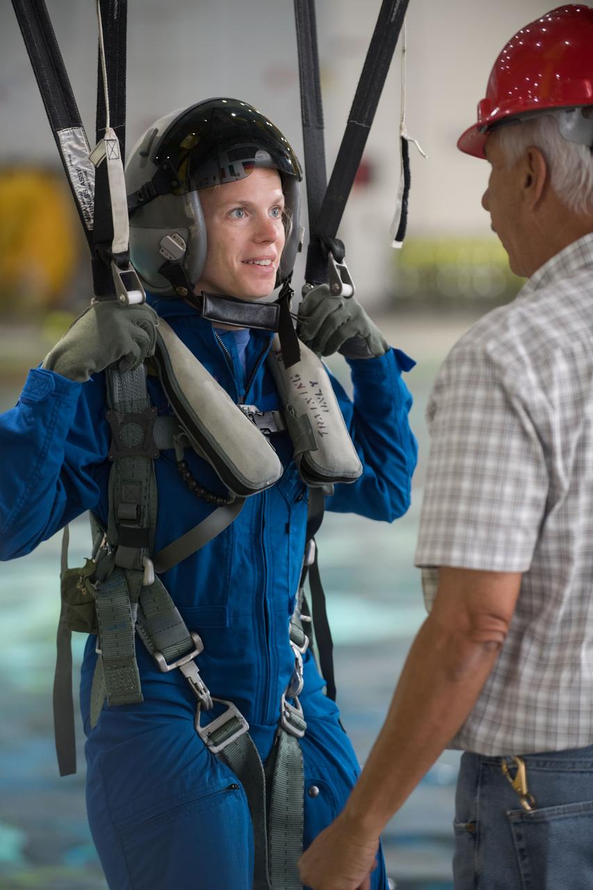 jsc2017e111782 (08-23-2017) --- 2017 NASA astronaut candidate Zena Cardman awaits next steps by instructors during water survival training at NASA Johnson Space Center’s Neutral Buoyancy Laboratory in Houston. Photo Credit: (NASA/David DeHoyos)