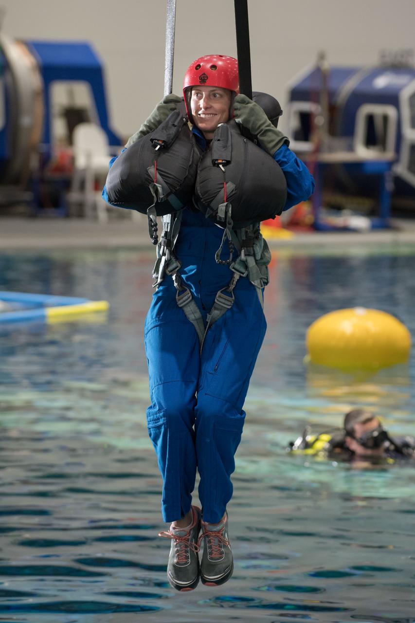 jsc2017e111785 (08-23-2017) --- 2017 NASA astronaut candidate Loral O’Hara awaits next steps by instructors during water survival training at NASA Johnson Space Center’s Neutral Buoyancy Laboratory in Houston. Photo Credit: (NASA/David DeHoyos)