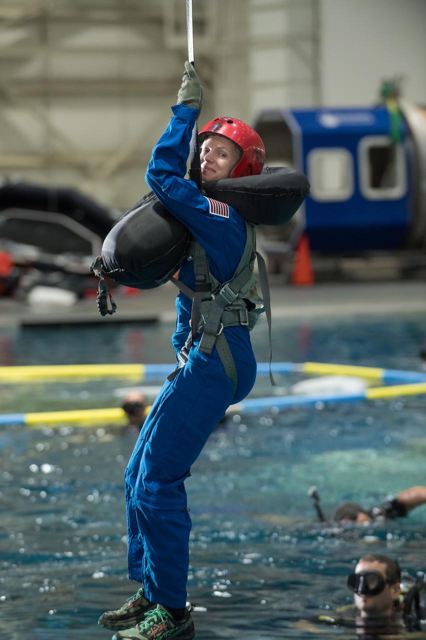 jsc2017e111798 (08-23-2017) --- 2017 NASA astronaut candidate Zena Cardman awaits next steps by instructors during water survival training at NASA Johnson Space Center’s Neutral Buoyancy Laboratory in Houston. Photo Credit: (NASA/David DeHoyos)