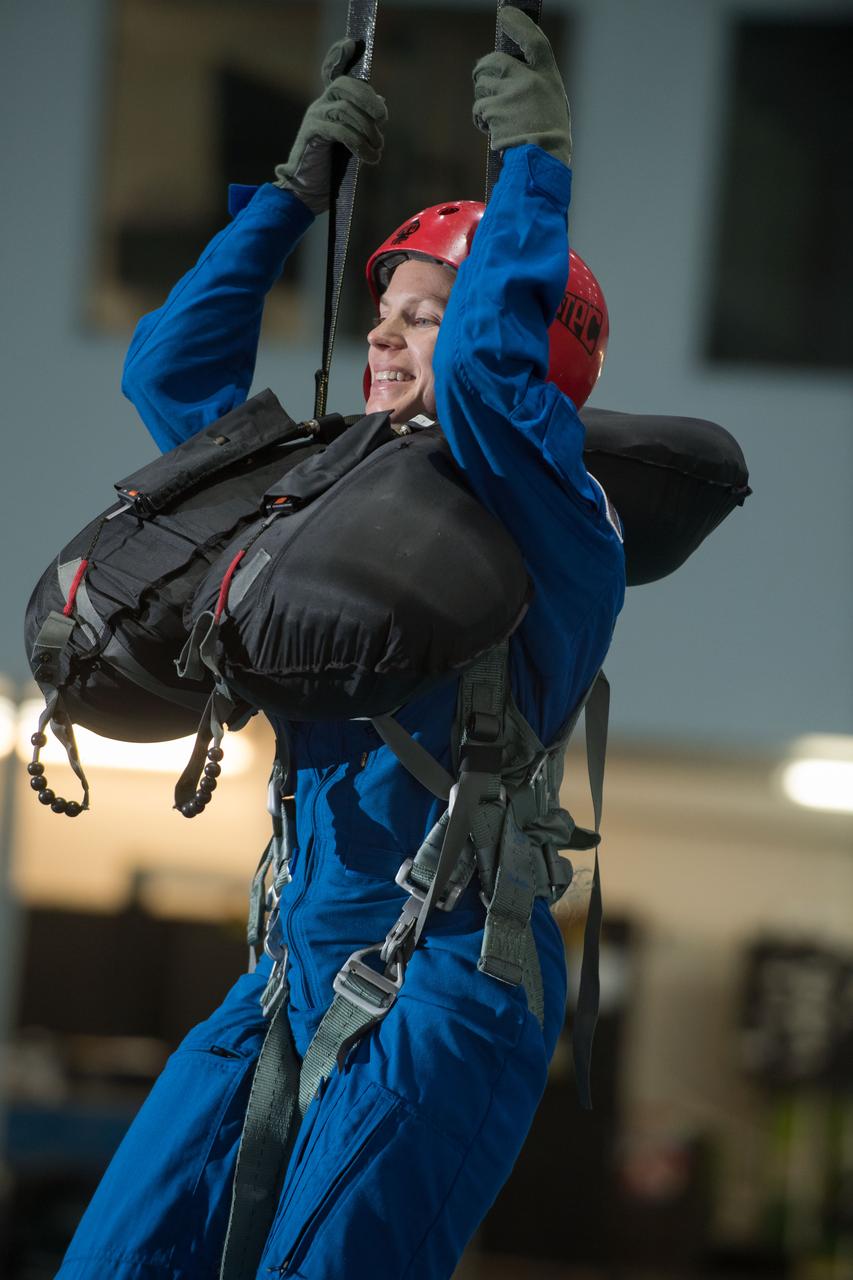 jsc2017e111799 (08-23-2017) ---2017 NASA astronaut candidate Zena Cardman awaits next steps by instructors during water survival training at NASA’s Johnson Space Center’s Neutral Buoyancy Laboratory in Houston. Photo Credit: (NASA/David DeHoyos)