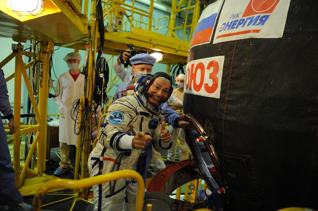 jsc2017e114476 (Aug. 28, 2017) --- In the Integration Facility at the Baikonur Cosmodrome in Kazakhstan, Expedition 53-54 crewmember Mark Vande Hei of NASA enters the Soyuz MS-06 spacecraft during pre-launch training activities Aug. 28. Vande Hei, Alexander Misurkin of Roscosmos and Joe Acaba of NASA will launch Sept. 13 on the Soyuz MS-06 for a five and a half month mission on the International Space Station. Credit: Gagarin Cosmonaut Training Center/Irina Peshkova