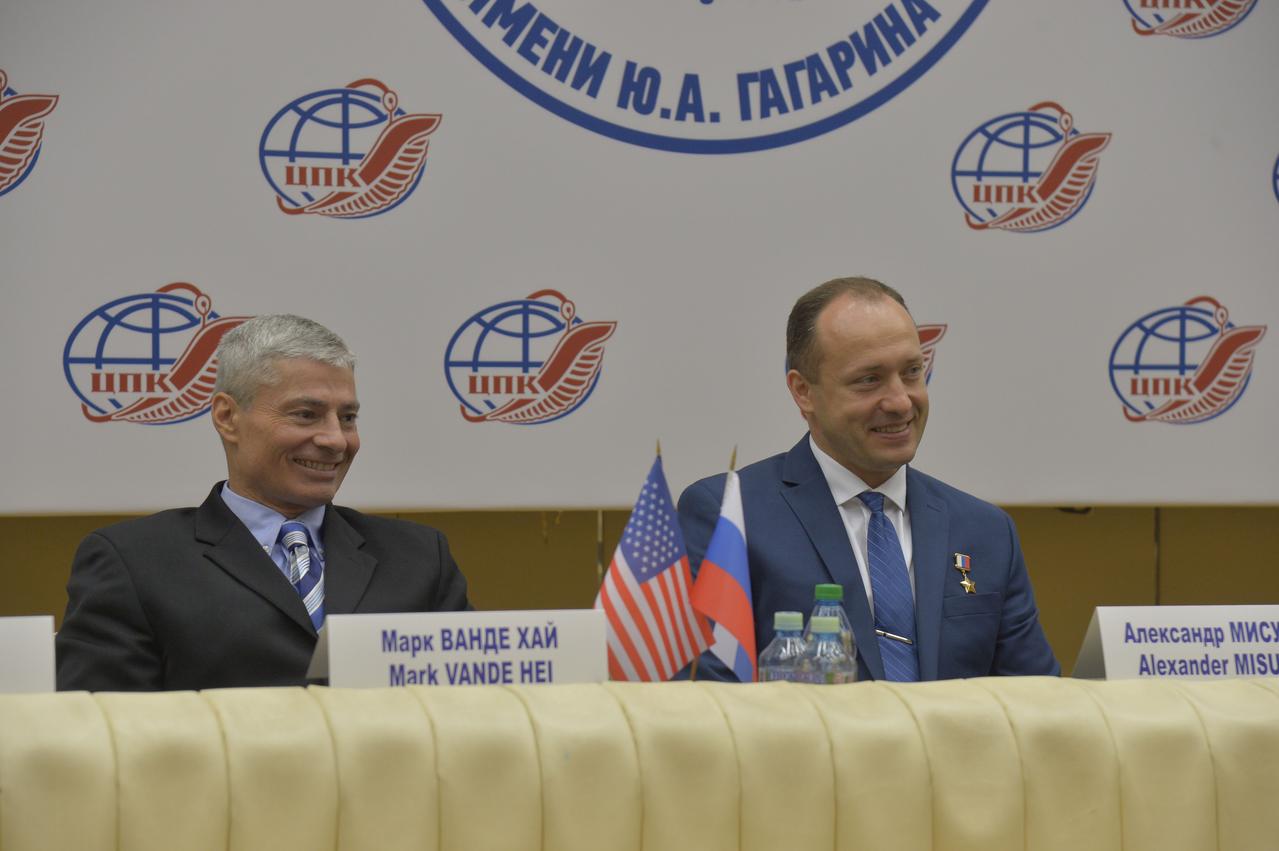 jsc2017e114478 (Sept. 1, 2017) --- At the Gagarin Cosmonaut Training Center in Star City, Russia, Expedition 53-54 crewmembers Mark Vande Hei of NASA (left) and Alexander Misurkin of Roscosmos listen to reporters’ questions during a news conference Sept. 1. Vande Hei, Misurkin and Joe Acaba of NASA will launch Sept. 13 on the Soyuz MS-06 spacecraft from the Baikonur Cosmodrome in Kazakhstan on a five and a half month mission aboard the International Space Station. Credit: NASA/Elizabeth Weissinger