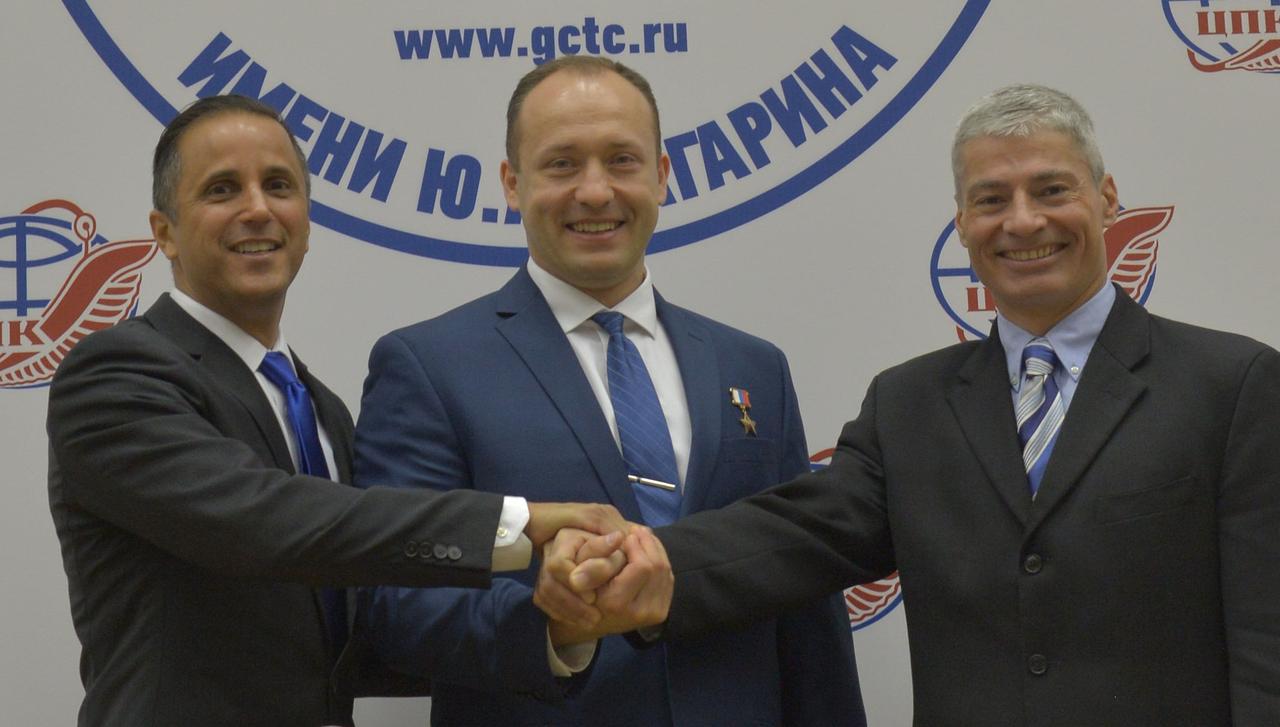 jsc2017e114482 (Sept. 1, 2017) --- At the Gagarin Cosmonaut Training Center in Star City, Russia, Expedition 53-54 crewmembers Joe Acaba of NASA (left), Alexander Misurkin of Roscosmos (center) and Mark Vande Hei of NASA (right) pose for pictures following a news conference Sept. 1. They will launch Sept. 13 on the Soyuz MS-06 spacecraft from the Baikonur Cosmodrome in Kazakhstan on a five and a half month mission aboard the International Space Station. Credit: NASA/Elizabeth Weissinger