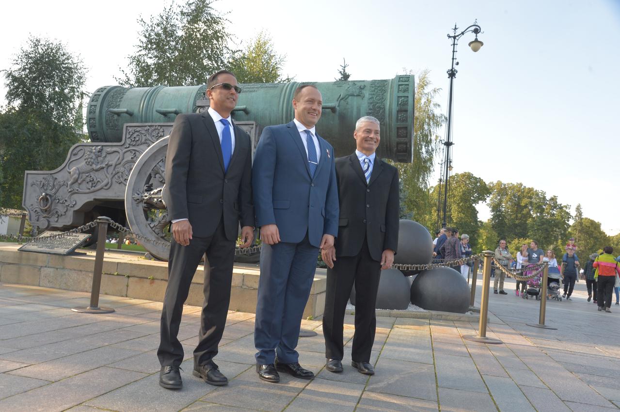 jsc2017e114486 (Sept. 1, 2017) --- Expedition 53-54 crewmembers Joe Acaba of NASA (left), Alexander Misurkin of Roscosmos (center) and Mark Vande Hei of NASA (right) pose for pictures in front of the Tsar Cannon in the Kremlin in Moscow Sept. 1 as part of traditional pre-launch ceremonies. They will launch Sept. 13 from the Baikonur Cosmodrome in Kazakhstan Sept. 13 on the Soyuz MS-06 spacecraft for a five and a half month mission on the International Space Station. Credit: NASA/Elizabeth Weissinger