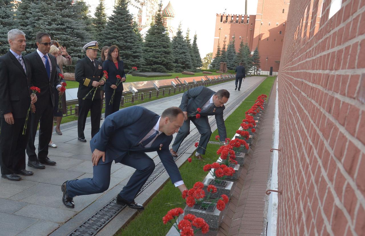 jsc2017e114488 (Sept. 1, 2017) --- Expedition 53-54 prime crewmember Alexander Misurkin of Roscosmos (foreground) and his backup and fellow cosmonaut Anton Shkaplerov lay flowers at the Kremlin Wall in Red Square in Moscow Sept. 1 as part of traditional pre-launch ceremonies. Misurkin and Joe Acaba and Mark Vande Hei of NASA will launch Sept. 13 from the Baikonur Cosmodrome in Kazakhstan Sept. 13 on the Soyuz MS-06 spacecraft for a five and a half month mission on the International Space Station. Credit: NASA/Elizabeth Weissinger