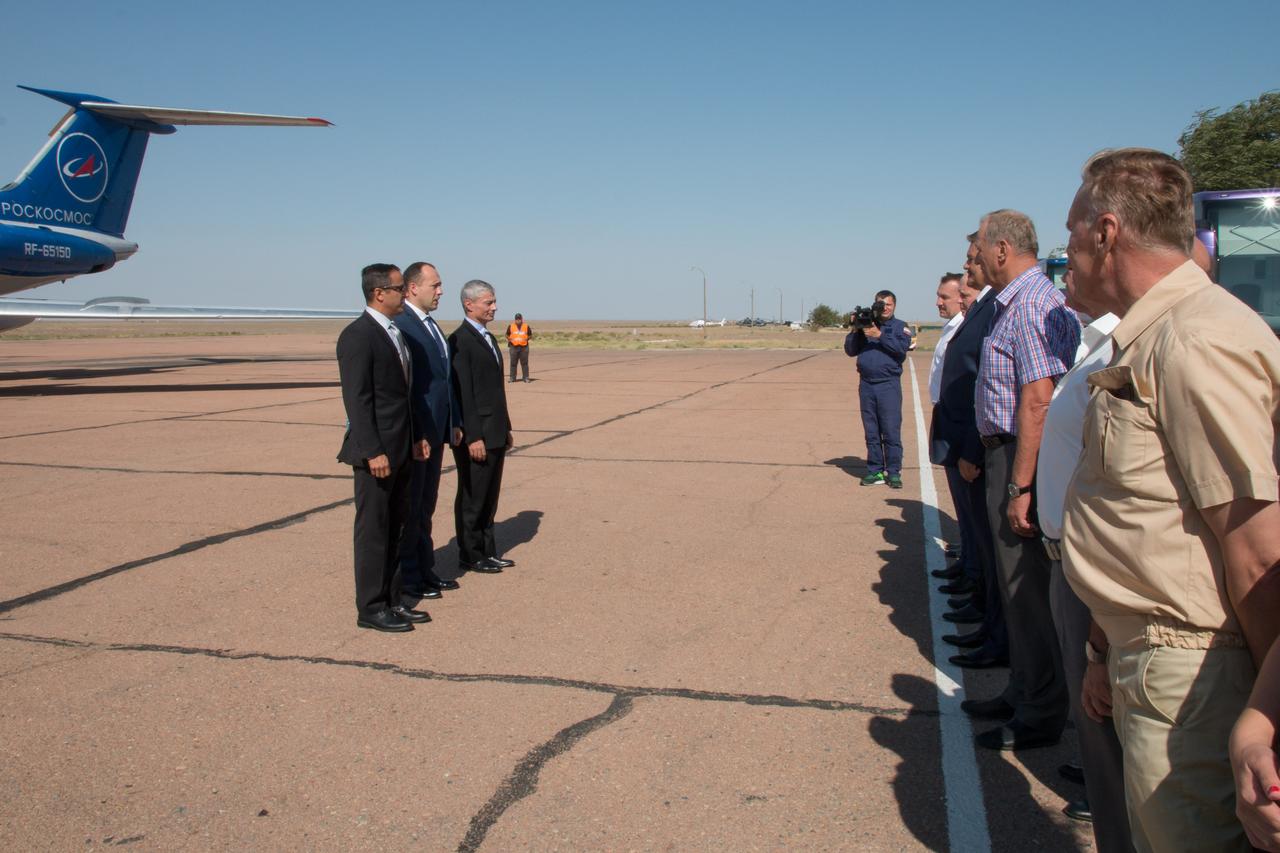 jsc2017e114750 (Sept. 6, 2017) --- Expedition 53-54 crewmembers Joe Acaba of NASA (left), Alexander Misurkin of Roscosmos (center) and Mark Vande Hei of NASA (right) report to Russian space officials after arriving at their launch site at the Baikonur Cosmodrome in Kazakhstan Sept. 6 following a flight from their training base in Star City, Russia for final pre-launch training. They will launch Sept. 13 on the Soyuz MS-06 spacecraft from the Baikonur Cosmodrome for a five and a half month mission on the International Space Station. Credit: NASA/Victor Zelentsov
