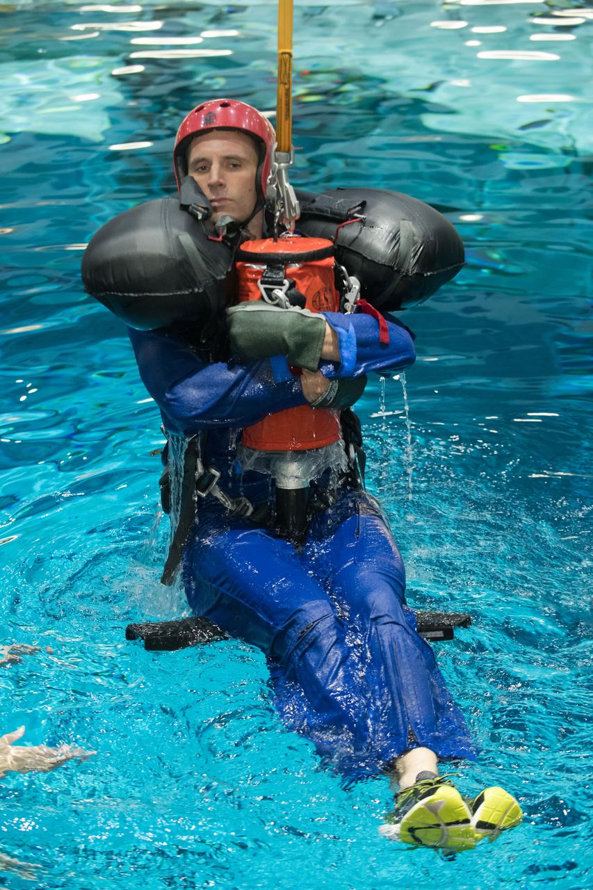 jsc2017e114948 (09-06-17) --- 2017 Canadian Spacy Agency astronaut candidate Joshua Kutryk awaits next steps by instructors during water survival training at NASA Johnson Space Center’s Neutral Buoyancy Laboratory in Houston. Photo Credit: (NASA/James Blair)