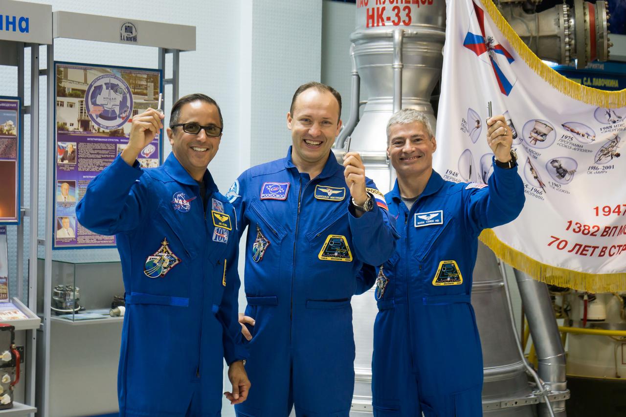 jsc2017e115134 (Sept. 7, 2017) --- In the Korolev Museum at the Baikonur Cosmodrome in Kazakhstan, Expedition 53-54 crewmembers Joe Acaba of NASA (left), Alexander Misurkin of Roscosmos (center) and Mark Vande Hei of NASA (right) display “launch keys” during a museum visit Sept. 7 as part of pre-launch activities. They will launch Sept. 13 on the Soyuz MS-06 spacecraft for a five and a half month mission on the International Space Station. Credit: NASA/Victor Zelentsov