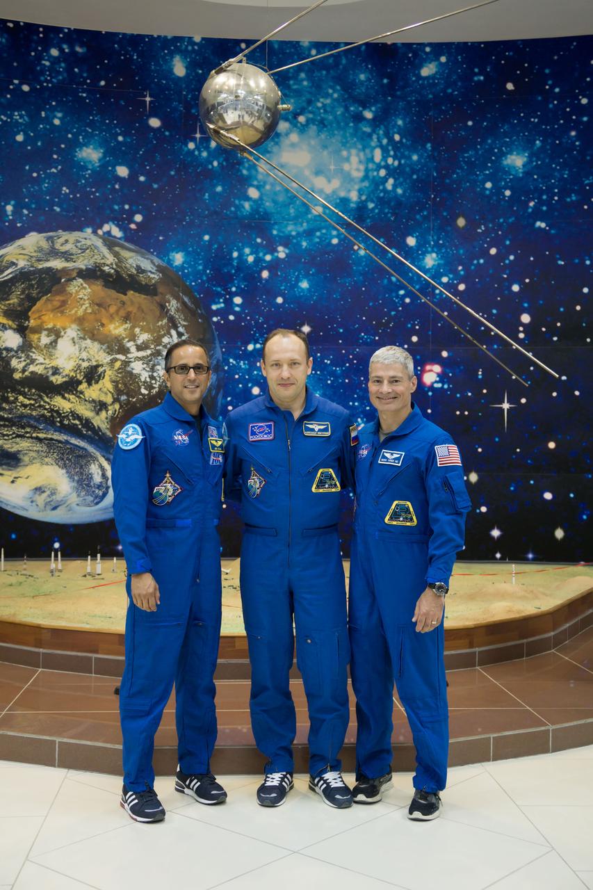 jsc2017e115135 (Sept. 7, 2017) --- In the Korolev Museum at the Baikonur Cosmodrome in Kazakhstan, Expedition 53-54 crewmembers Joe Acaba of NASA (left), Alexander Misurkin of Roscosmos (center) and Mark Vande Hei of NASA (right) pose for pictures during a museum visit Sept. 7 as part of pre-launch activities. They will launch Sept. 13 on the Soyuz MS-06 spacecraft for a five and a half month mission on the International Space Station. Credit: NASA/Victor Zelentsov