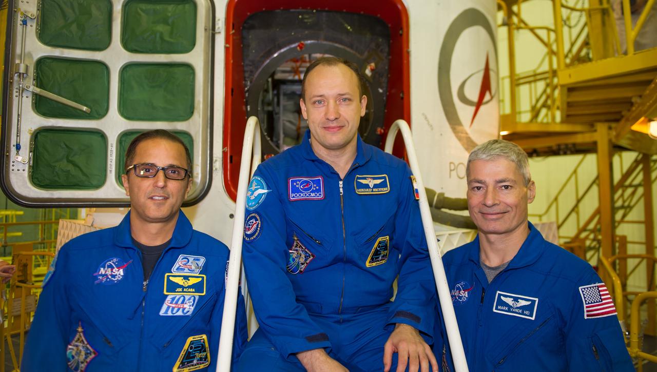 jsc2017e115139 (Sept. 7, 2017) --- At the Baikonur Cosmodrome in Kazakhstan, Expedition 53-54 crewmembers Joe Acaba of NASA (left), Alexander Misurkin of Roscosmos (center) and Mark Vande Hei of NASA (right) pose for pictures Sept. 7 in front of the Soyuz MS-06 spacecraft during final fit check training activities. They will launch Sept. 13 on the Soyuz MS-06 spacecraft for a five and a half month mission on the International Space Station. Credit: Gagarin Cosmonaut Training Center/Irina Peshkova