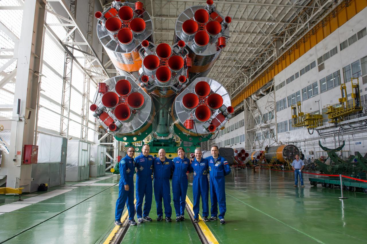 jsc2017e115142 (Sept. 7, 2017) --- At the Baikonur Cosmodrome in Kazakhstan, the Expedition 53-54 prime and backup crewmembers pose for pictures Sept. 7 in front of the first stage engines of the Soyuz booster the prime crew will ride to orbit. From left to right are Joe Acaba of NASA, Alexander Misurkin of Roscosmos , Scott Tingle of NASA, Shannon Walker of NASA, Mark Vande Hei of NASA and Anton Shkaplerov of Roscosmos. Acaba, Misurkin and Vande Hei will launch Sept. 13 on the Soyuz MS-06 spacecraft for a five and a half month mission on the International Space Station. Credit: Gagarin Cosmonaut Training Center/Irina Peshkova