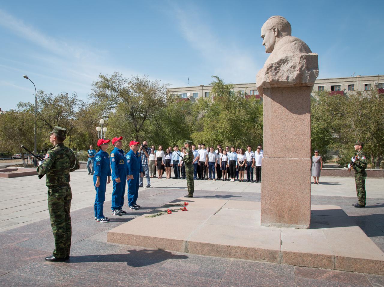 jsc2017e115217 (Sept.. 8, 2017) --- In the town of Baikonur, Kazakhstan, Expedition 53-54 backup crewmembers Shannon Walker of NASA, Anton Shkaplerov of Roscosmos and Scott Tingle of NASA pay tribute after laying flowers at the statue of Russia’s great space designer Sergey Korolev in a traditional ceremony Sept. 8. They are serving as backups to the prime crewmembers, Joe Acaba of NASA, Alexander Misurkin of Roscosmos and Mark Vande Hei of NASA, who will launch on Sept. 13 from the Baikonur Cosmodrome in Kazakhstan on the Soyuz MS-06 spacecraft for a five and a half month mission on the International Space Station. Credit: NASA/Victor Zelentsov
