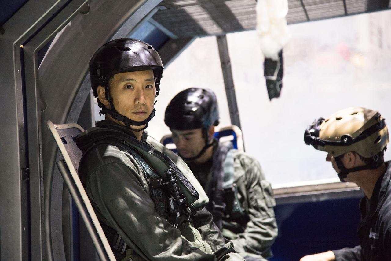 jsc2017e118989 (September 21, 2017) --- 2017 NASA astronaut candidate Jonny Kim readies for helicopter water survival training at NASA Johnson Space Center’s Neutral Buoyancy Laboratory in Houston. Photo Credit: (NASA/Josh Valcarcel)