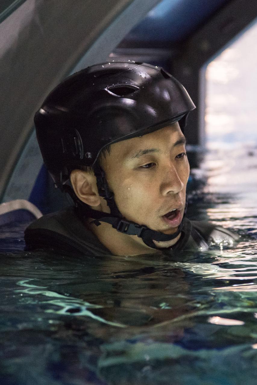 jsc2017e118991 (September 21, 2017) --- 2017 NASA astronaut candidate Jonny Kim undergoes helicopter water survival training at NASA Johnson Space Center’s Neutral Buoyancy Laboratory in Houston. Photo Credit: (NASA/Josh Valcarcel)