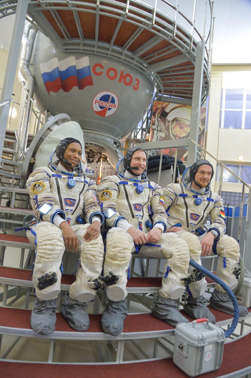 jsc2017e134969 - At the Gagarin Cosmonaut Training Center in Star City, Russia, Expedition 54-55 backup crewmembers Jeanette Epps of NASA (left), Sergey Prokopyev of the Russian Federal Space Agency (Roscosmos, center) and Alexander Gerst of the European Space Agency (right) answer reporters’ questions Nov. 28 as part of their final qualification exam activities. They are serving as backups to the prime crew, Anton Shkaplerov of Roscosmos, Scott Tingle of NASA and Norishige Kanai of the Japan Aerospace Exploration Agency (JAXA), who will launch Dec. 17 on their Soyuz MS-07 spacecraft for a five-month mission on the International Space Station...NASA/Elizabeth Weissinger.