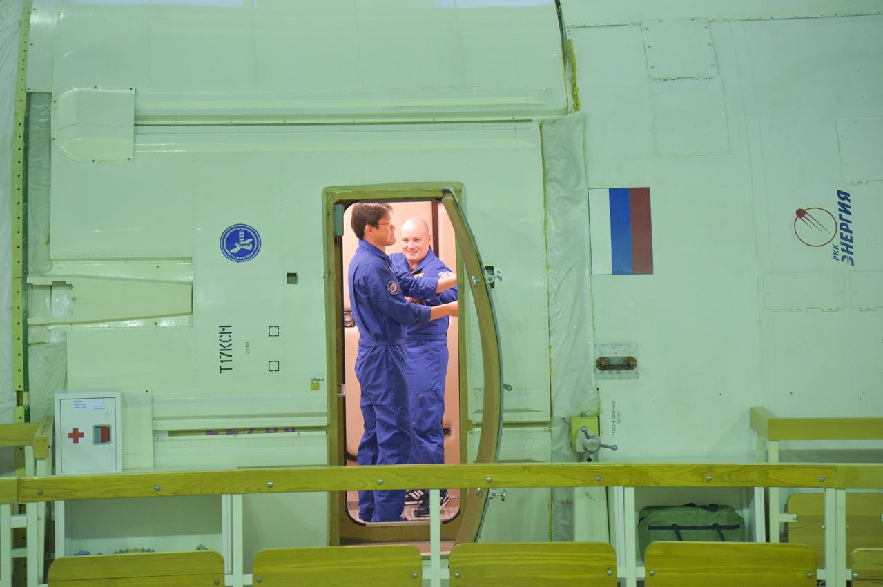 jsc2017e134974 - At the Gagarin Cosmonaut Training Center in Star City, Russia, Expedition 54-55 prime crewmembers Norishige Kanai of the Japan Aerospace Exploration Agency (JAXA, left) and Scott Tingle of NASA (right) are seen in a space station trainer as part of the crew’s qualification exam training activities Nov. 28. Kanai, Tingle and Anton Shkaplerov of the Russian Federal Space Agency (Roscosmos) will launch Dec. 17 on their Soyuz MS-07 spacecraft for a five-month mission on the International Space Station...NASA/Elizabeth Weissinger.