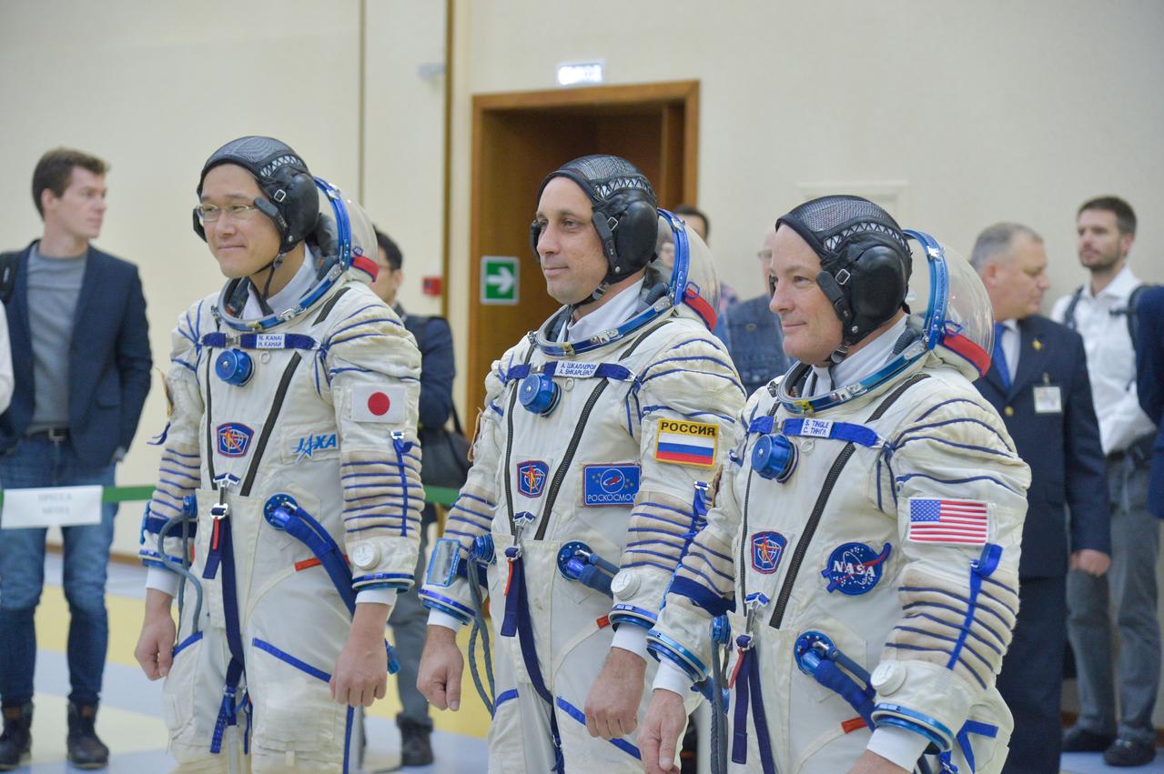 jsc2017e135199 - At the Gagarin Cosmonaut Training Center in Star City, Russia, Expedition 54-55 prime crewmembers Norishige Kanai of the Japan Aerospace Exploration Agency (JAXA, left), Anton Shkaplerov of the Russian Federal Space Agency (Roscosmos, center) and Scott Tingle of NASA (right) report to officials Nov. 29 for the start of their final qualification exam activities. They will launch Dec. 17 on the Soyuz MS-07 spacecraft from the Baikonur Cosmodrome in Kazakhstan for a five-month mission on the International Space Station...NASA/Elizabeth Weissinger.