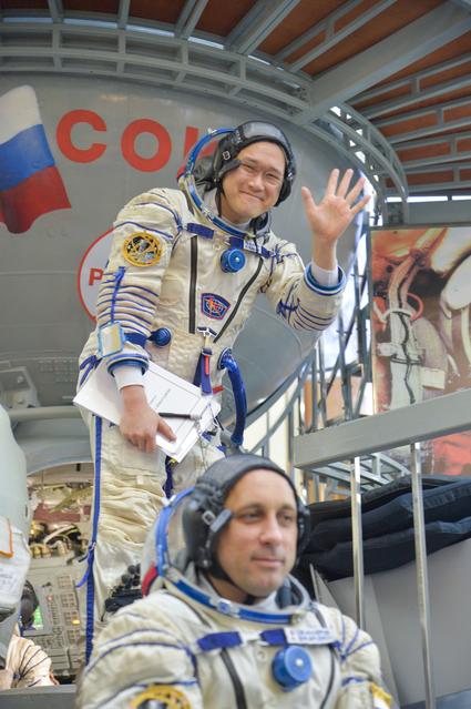 NASA image: jsc2017e135210 - At the Gagarin Cosmonaut Training Center in Star City, Russia, Expedition 54-55 prime crewmember Norishige Kanai of the Japan Aerospace Exploration Agency (JAXA) waves to reporters as he boards a Soyuz spacecraft simulator Nov. 29 as part