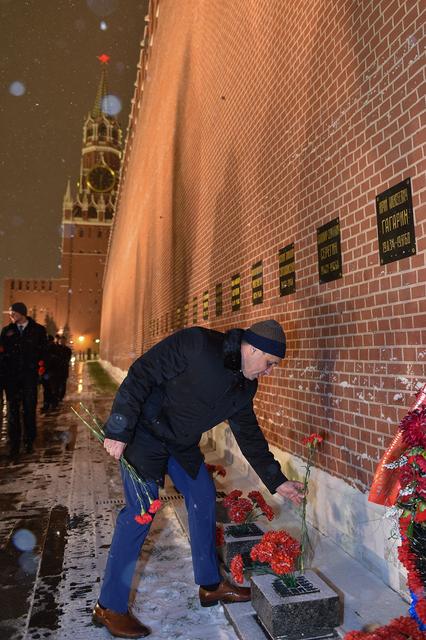 jsc2017e136054 - On a snowy night at Red Square in Moscow, Expedition 54-55 crewmember Anton Shkaplerov of the Russian Federal Space Agency (Roscosmos) lays flowers at the Kremlin Wall where Russian space icons are interred in traditional pre-launch ceremonies Nov. 30. Shkaplerov, Norishige Kanai of the Japan Aerospace Exploration Agency (JAXA) and Scott Tingle of NASA will launch from the Baikonur Cosmodrome in Kazakhstan on the Soyuz MS-07 spacecraft Dec. 17 for a five-month mission on the International Space Station...Andrey Shelepin/Gagarin Cosmonaut Training Center.