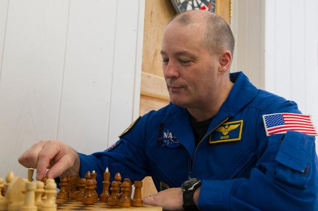 NASA image: jsc2017e137337 - At the Cosmonaut Hotel crew quarters in Baikonur, Kazakhstan, Expedition 54-55 prime crewmember Scott Tingle of NASA plays a game of chess Dec. 11 during a break in his pre-launch training. Tingle, Norishige Kanai of the Japan Aerospace E