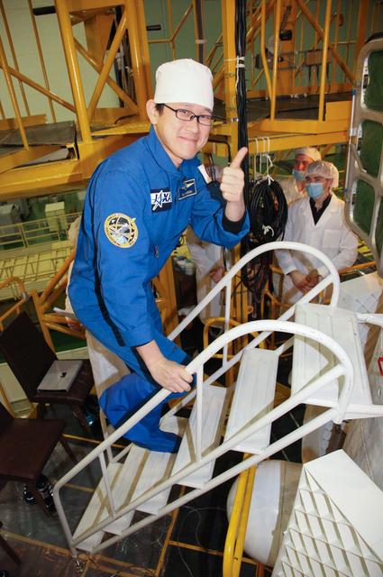jsc2017e138113 - At the Integration Facility at the Baikonur Cosmodrome in Kazakhstan, Expedition 54-55 prime crewmember Norishige Kanai of the Japan Aerospace Exploration Agency (JAXA) boards the Soyuz MS-07 spacecraft Dec. 13 for the continuation of pre-launch training. Kanai, Scott Tingle of NASA and Anton Shkaplerov of the Russian Federal Space Agency (Roscosmos) will launch Dec. 17 on the Soyuz MS-07 vehicle for a five month mission on the International Space Station...Andrey Shelepin/Gagarin Cosmonaut Training Center.