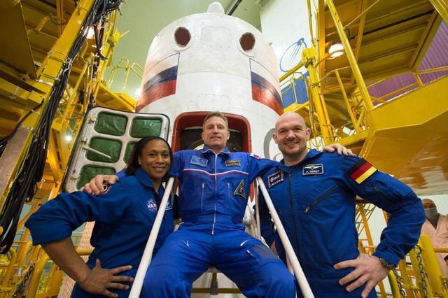 NASA image: jsc2017e138121 - At the Integration Facility at the Baikonur Cosmodrome in Kazakhstan, the Expedition 54-55 backup crewmembers pose for pictures Dec. 13 in front of the Soyuz MS-07 spacecraft during pre-launch training. Jeanette Epps of NASA (left), Serge