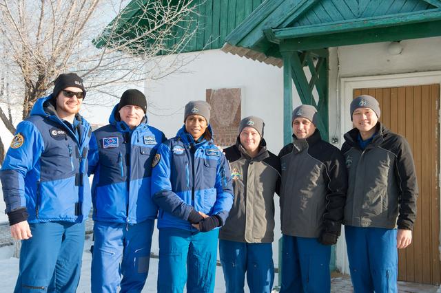 NASA image: jsc2017e138126 - At the Baikonur Cosmodrome in Kazakhstan, the Expedition 54-55 prime and backup crewmembers pose for pictures Dec. 13 in front of the cottage where Yuri Gagarin slept on the night before his launch April 12, 1961 to become the first human