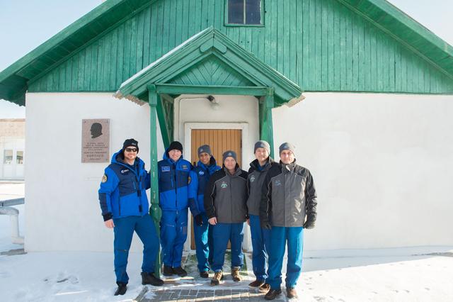 jsc2017e138127 - At the Baikonur Cosmodrome in Kazakhstan, the Expedition 54-55 prime and backup crewmembers pose for pictures Dec. 13 in front of the cottage where the iconic Russian space designer Sergey Korolev slept on the night before Yuri Gagarin launched April 12, 1961 to become the first human to fly in space. Korolev’s cottage is next to the cottage where Gagarin slept on the eve of his launch. From left to right are backup crewmembers Alexander Gerst of the European Space Agency, Sergey Prokopyev of the Russian Federal Space Agency (Roscosmos) and Jeanette Epps of NASA, and prime crewmembers Scott Tingle of NASA, Anton Shkaplerov of Roscosmos and Norishige Kanai of the Japan Aerospace Exploration Agency. Tingle, Kanai and Shkaplerov will launch Dec. 17 on the Soyuz MS-07 spacecraft for a five month mission on the International Space Station...Andrey Shelepin/Gagarin Cosmonaut Training Center.